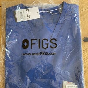 Brand new FIGS scrubs set in the color denim. Women’s Small.